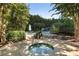 Relaxing pool area featuring a hot tub, seating, and lush greenery, offering a serene outdoor retreat at 700 Park Regency Ne Pl # 803, Atlanta, GA 30326
