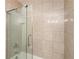Shower with textured tiling and a partial glass enclosure at 700 Park Regency Ne Pl # 803, Atlanta, GA 30326