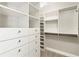 Well-organized walk-in closet featuring drawers, shelving, and hanging rods, providing ample storage space with a neutral design at 700 Park Regency Ne Pl # 803, Atlanta, GA 30326