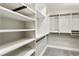 Spacious walk-in closet with custom shelving and ample storage space at 700 Park Regency Ne Pl # 803, Atlanta, GA 30326
