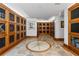 Wine cellar with decorative stone flooring and custom-built wooden storage cabinets for an extensive collection at 700 Park Regency Ne Pl # 803, Atlanta, GA 30326