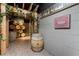 Rustic wine cellar entrance adorned with grapevines, wooden barrels, and a display of wine bottles at 700 Park Regency Ne Pl # 803, Atlanta, GA 30326