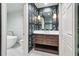 Elegant bathroom with a modern vanity, patterned wallpaper, and a soaking tub for relaxation at 2411 Mitchell Ne Rd, Marietta, GA 30062