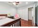 Comfortable bedroom with hardwood flooring, closet, and a connecting door at 2411 Mitchell Ne Rd, Marietta, GA 30062