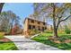 Traditional brick home with manicured lawn, inviting stairs, and lush landscaping provides a welcoming exterior at 2411 Mitchell Ne Rd, Marietta, GA 30062