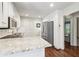 A kitchen with white cabinets, stainless steel appliances, and granite countertops at 2411 Mitchell Ne Rd, Marietta, GA 30062