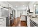 Kitchen with stainless steel appliances, granite countertops, and access to dining area at 2411 Mitchell Ne Rd, Marietta, GA 30062
