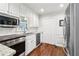 Updated kitchen featuring white cabinets and stainless steel appliances at 2411 Mitchell Ne Rd, Marietta, GA 30062