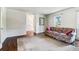 Inviting living room with hardwood floors, a patterned sofa, and a view into the front yard at 2411 Mitchell Ne Rd, Marietta, GA 30062
