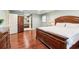 Spacious main bedroom boasts hardwood floors, an ensuite bathroom, and a window for natural light at 2411 Mitchell Ne Rd, Marietta, GA 30062