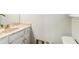 Bathroom featuring a vanity with a marble countertop, sink, toilet and painted in a neutral tone at 2411 Mitchell Ne Rd, Marietta, GA 30062