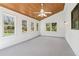 Bright sunroom featuring a wood plank ceiling, neutral carpet, and multiple windows providing ample natural light at 2411 Mitchell Ne Rd, Marietta, GA 30062