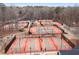 Aerial view of multiple well-maintained tennis and pickleball courts with people playing at 2611 Winterthur Main Nw, Kennesaw, GA 30144