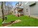 Exterior back view of multi-level deck and luscious backyard at 2611 Winterthur Main Nw, Kennesaw, GA 30144