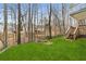 Back yard with newly planted grass and wooden stairs at 2611 Winterthur Main Nw, Kennesaw, GA 30144
