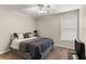 Cozy bedroom with carpet, ceiling fan, and neutral colors for a relaxing atmosphere at 2611 Winterthur Main Nw, Kennesaw, GA 30144