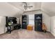 Bedroom with desk, bookcases, ceiling fan, and natural light from the window at 2611 Winterthur Main Nw, Kennesaw, GA 30144
