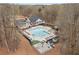 Aerial view of a large community pool with lounge chairs and a play area at 2611 Winterthur Main Nw, Kennesaw, GA 30144