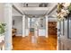 Elegant foyer with hardwood floors, white columns, and a view into adjacent rooms at 2611 Winterthur Main Nw, Kennesaw, GA 30144