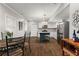 Open-concept kitchen and dining area featuring stainless steel appliances and island at 2611 Winterthur Main Nw, Kennesaw, GA 30144
