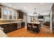 Spacious kitchen boasts dark wood cabinets, granite countertops, stainless steel appliances, and a large island at 2611 Winterthur Main Nw, Kennesaw, GA 30144
