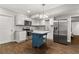 Kitchen area featuring granite countertops, stainless appliances, and white cabinetry at 2611 Winterthur Main Nw, Kennesaw, GA 30144