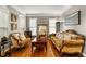 Cozy living room with hardwood floors, neutral walls, and classic furniture at 2611 Winterthur Main Nw, Kennesaw, GA 30144