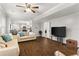 Open living room with hardwood floors and comfortable sofas at 2611 Winterthur Main Nw, Kennesaw, GA 30144