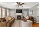 Inviting living room features a cozy fireplace and comfortable seating, perfect for relaxing at 2611 Winterthur Main Nw, Kennesaw, GA 30144