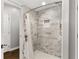 Modern tiled shower with rain shower head and a built-in niche at 2611 Winterthur Main Nw, Kennesaw, GA 30144