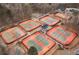 Aerial view of multiple tennis courts with players in a well-maintained community at 2611 Winterthur Main Nw, Kennesaw, GA 30144