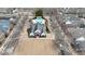 Aerial view of a home within a quiet neighborhood, showcasing a community pool and well-maintained streets at 4531 Flowering Br, Powder Springs, GA 30127