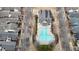 Overhead shot of an inviting community pool and clubhouse nestled among charming residential homes at 4531 Flowering Br, Powder Springs, GA 30127