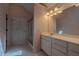 Well-lit bathroom with a walk-in shower, vanity, and bright lighting at 4531 Flowering Br, Powder Springs, GA 30127