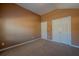 Bedroom featuring neutral paint and carpet, a vaulted ceiling, and two closets at 4531 Flowering Br, Powder Springs, GA 30127