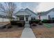 Charming single-story home with a welcoming front porch and well-maintained landscaping at 4531 Flowering Br, Powder Springs, GA 30127