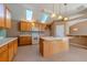 Cozy kitchen with a center island, skylights, lots of cabinets, and tile flooring at 4531 Flowering Br, Powder Springs, GA 30127