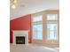 Living room featuring a fireplace, neutral paint, carpet, and bright natural light at 4531 Flowering Br, Powder Springs, GA 30127