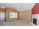 Open living room featuring neutral paint, carpet, a fireplace, and plenty of natural light at 4531 Flowering Br, Powder Springs, GA 30127