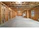 Unfinished basement featuring framed walls, ready for customization and expansion for versatile living space at 4921 Slaton Dr, Acworth, GA 30101