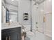Stylish bathroom with a modern vanity, shower-tub combo, and gold fixtures at 4921 Slaton Dr, Acworth, GA 30101