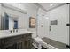 Contemporary bathroom with dark wood vanity, marble countertop, and sleek glass shower at 4921 Slaton Dr, Acworth, GA 30101
