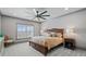 Serene bedroom with a ceiling fan, natural light, and neutral tones, offering a relaxing retreat at 4921 Slaton Dr, Acworth, GA 30101