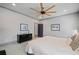 Relaxing bedroom with plush carpet, neutral walls, and an oversized ceiling fan at 4921 Slaton Dr, Acworth, GA 30101