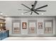 Bright bonus room features a large ceiling fan, custom built-in shelving, and four large windows at 4921 Slaton Dr, Acworth, GA 30101