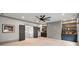 Cozy bonus room features a large ceiling fan, custom built-in shelving, and stylish gray walls at 4921 Slaton Dr, Acworth, GA 30101
