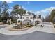 Elegant community entrance with a white brick gatehouse and meticulously landscaped grounds, exudes upscale charm at 4921 Slaton Dr, Acworth, GA 30101