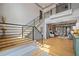Spacious foyer with hardwood floors, modern staircase, and open access to living area at 4921 Slaton Dr, Acworth, GA 30101