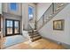 Hardwood staircase and foyer with natural light and an open floorplan at 4921 Slaton Dr, Acworth, GA 30101