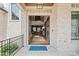 Charming exterior featuring white brick, large windows, and an open doorway at 4921 Slaton Dr, Acworth, GA 30101